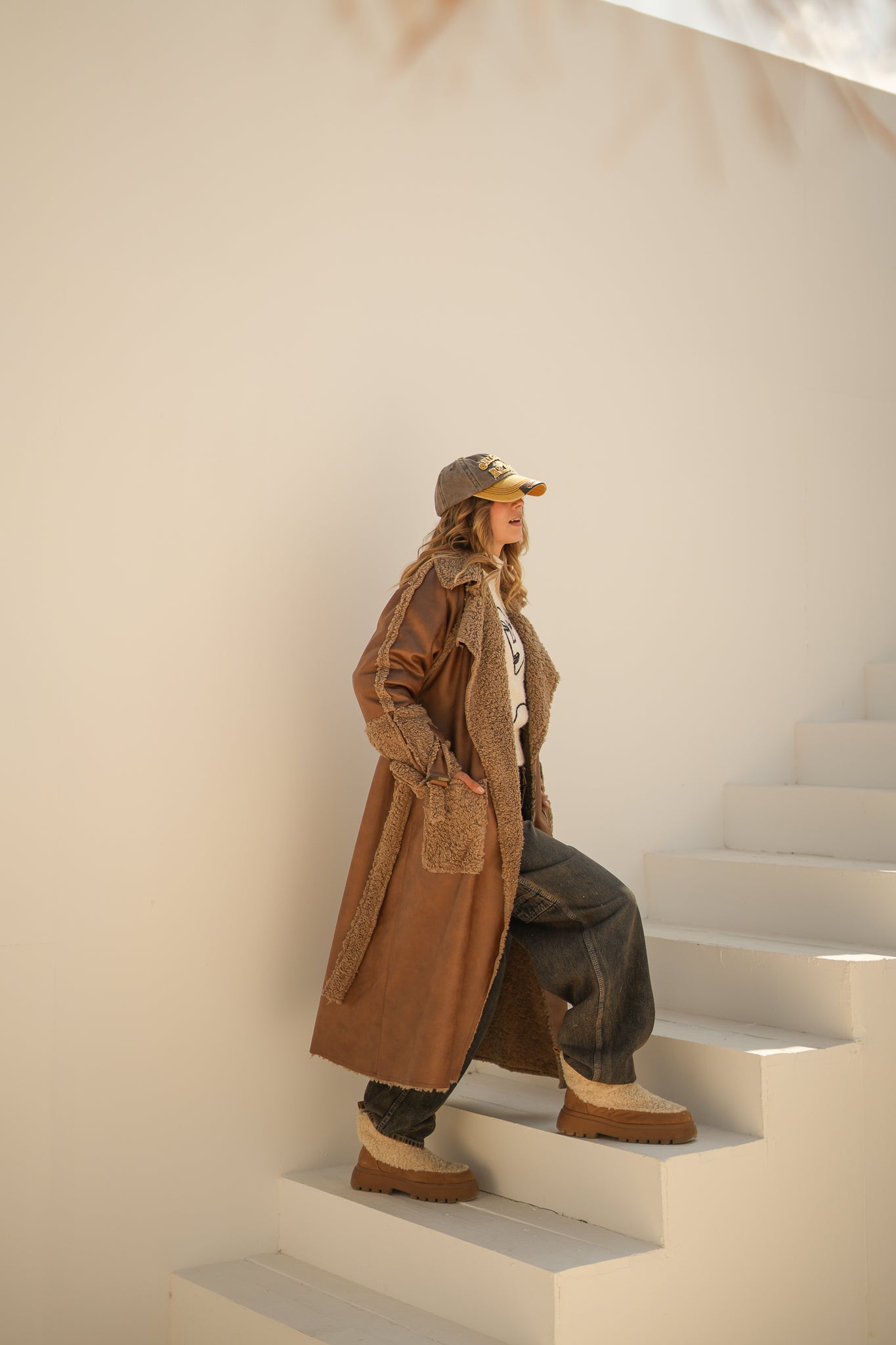 raw edge faux leather long coat