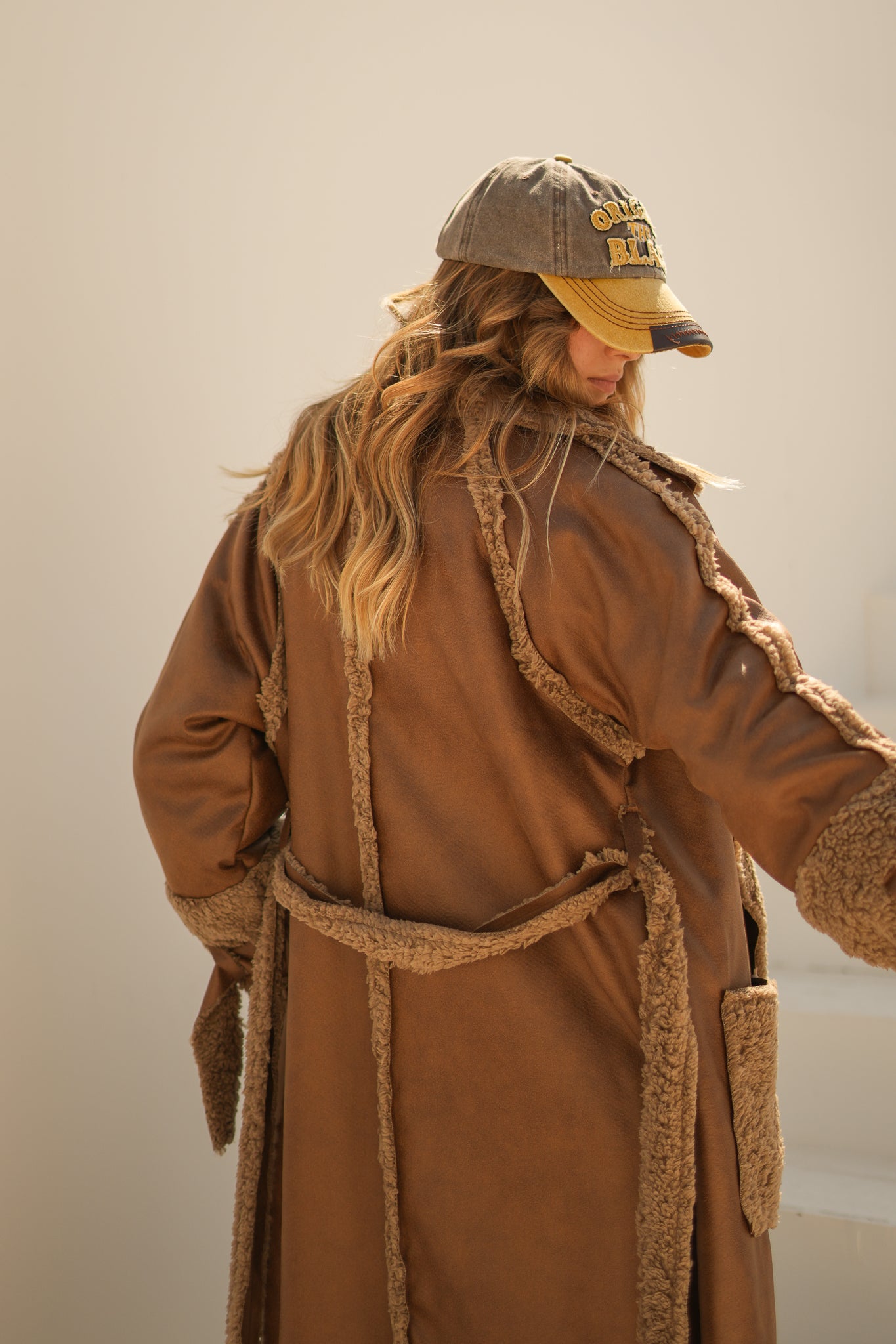 raw edge faux leather long coat